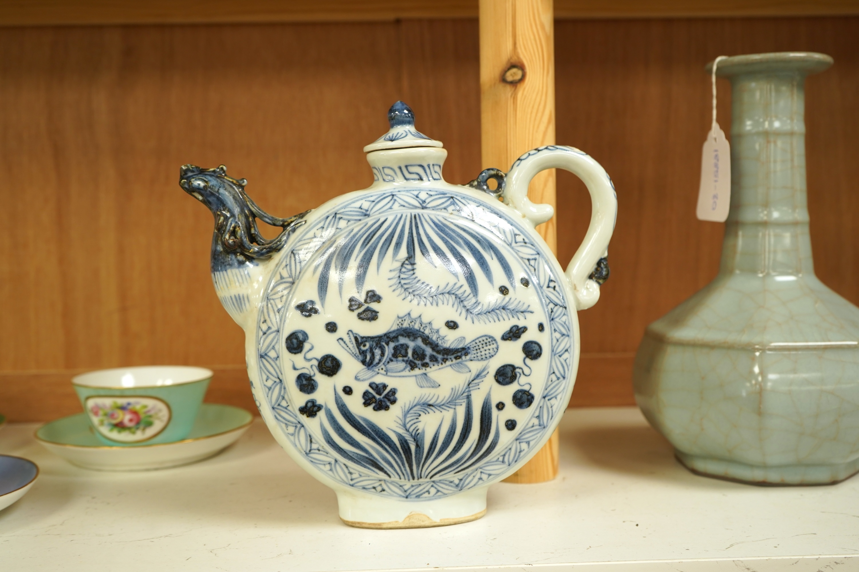 A Chinese blue and white moon flask wine pot with phoenix spout, 21cm high